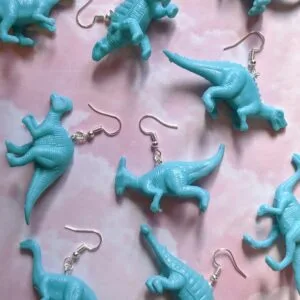 orange mismatch odd pair Blue turquoise Dinosaur Dino Jurassic park Earring earrings jewellery rave raver raving disco clubbing festival wear neon y2k clubwear hand made handmade cybertwee neon clubkid club kid carnival streetstyle harajuku street style cyber kinderwhore techno basement underground urban club kid klub kitsch party kei Altboy alternative style alt fashion clowncore aesthetic eboy egirl goblincore goth style grudge jfashion kidcore party kei pastel goth punk boy girl style queer LGBT shop buisness scenecore rainbowcore