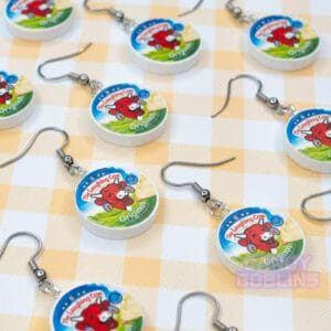 Many Laughing Cow earrings laid out