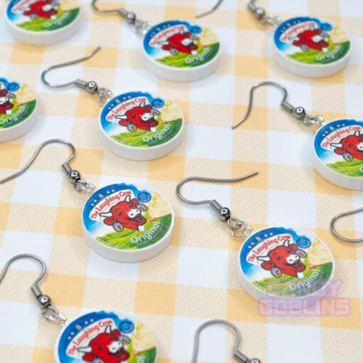 Many Laughing Cow earrings laid out