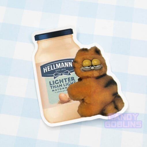 A sticker of a funky looking Garfield toy holding on a jar of mayonnaise.