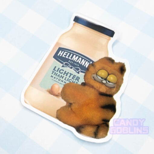 A sticker of a bizarre looking Garfield toy holding on a jar of mayonnaise.