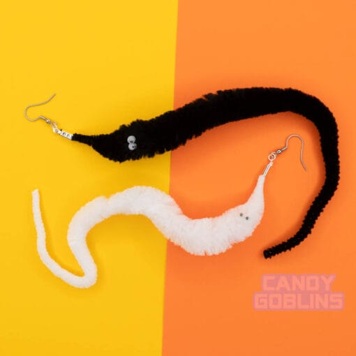 A black and white pair of fuzzy worm earrings