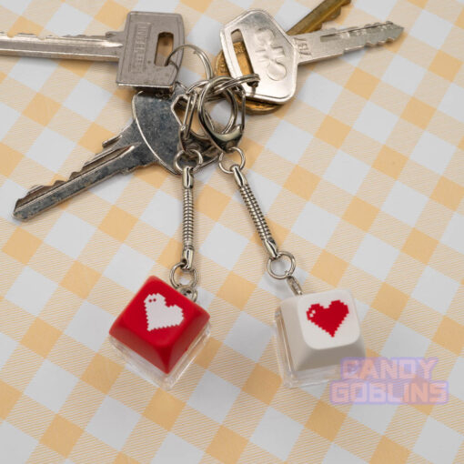 Two red and white Keyboard Switch Keychains