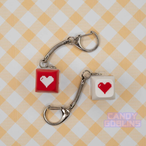 Two red and white Keyboard Switch Keychains