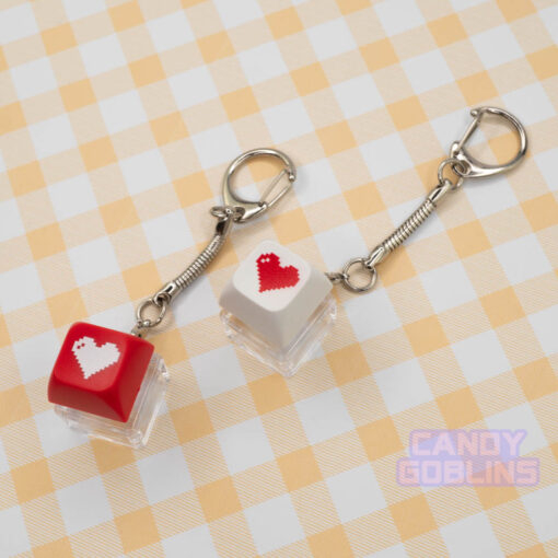 Two red and white Keyboard Switch Keychains