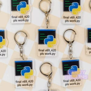 Multiple of our Python keychains are laid out against a pastel yellow backdrop. The keychain features the Python logo, with text underneath that reads "final v69_420 pls work.py".