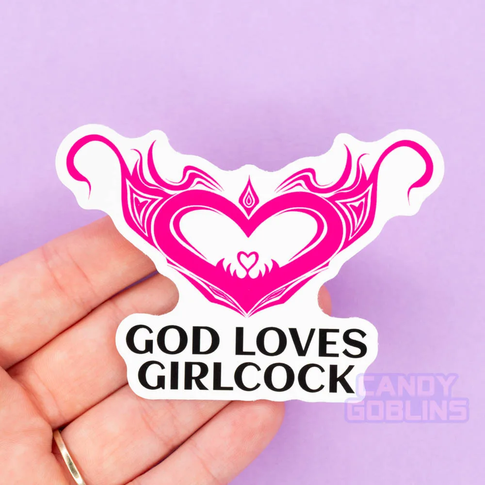 A person holds a sticker that reads God Loves Girlcock, and above is a hentai womb tattoo design.