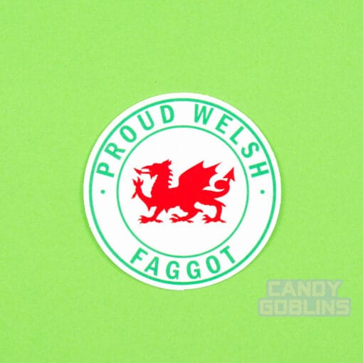A Welsh sticker on a green background. The sticker has the Welsh dragon in the middle, and text around it reads "Proud Welsh Faggot"