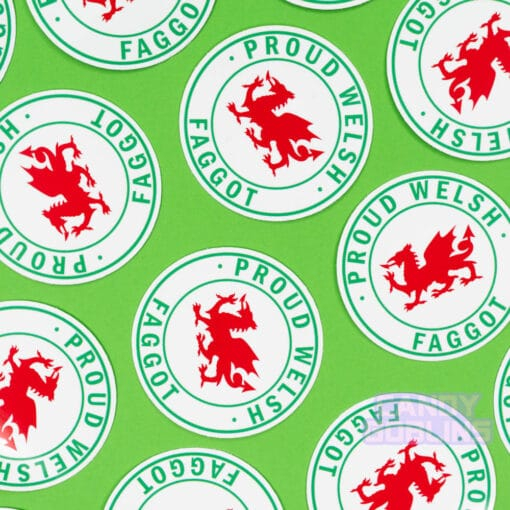 Stickers are scattered across a green background. The stickers have Welsh dragons on them, and text around it reads "Proud Welsh Faggot"