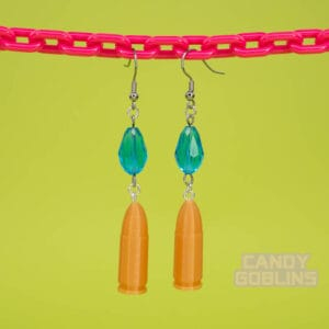 A pair of our Revolver Earrings hang from a pink chain.