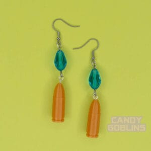 A pair of our Revolver Earrings. clearly photographed so you can see the blue beads, and gold bullets