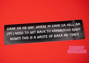 A black bumper sticker shown against a red background. The sticker reads: DAME DA NE GUY: WHERE IN DAME DA HELL AM I?! I NEED TO GET BACK TO KAMUROCHO RIGHT NOW!!! THIS IS A WASTE OF BAKA ME-TIME!!