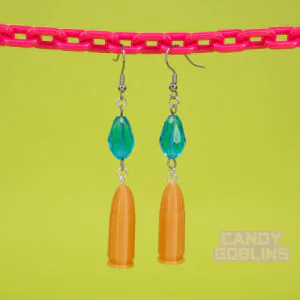 A pair of our Revolver Earrings hang from a pink chain.